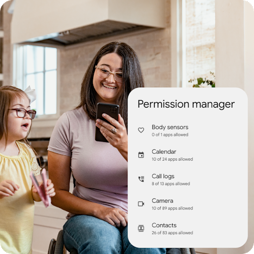 A parent in a wheelchair smiles looking at an Android phone while their child sings and dances. A graphic overlay highlights the details of permission manager including the number of apps allowed access to body sensors, calendar, call logs, camera, and contacts.