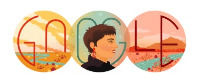 A woman with short hair, brown hair, and red earrings in front of the word 'Google'